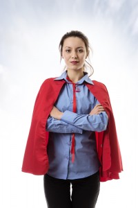 business woman wearing a super hero cape